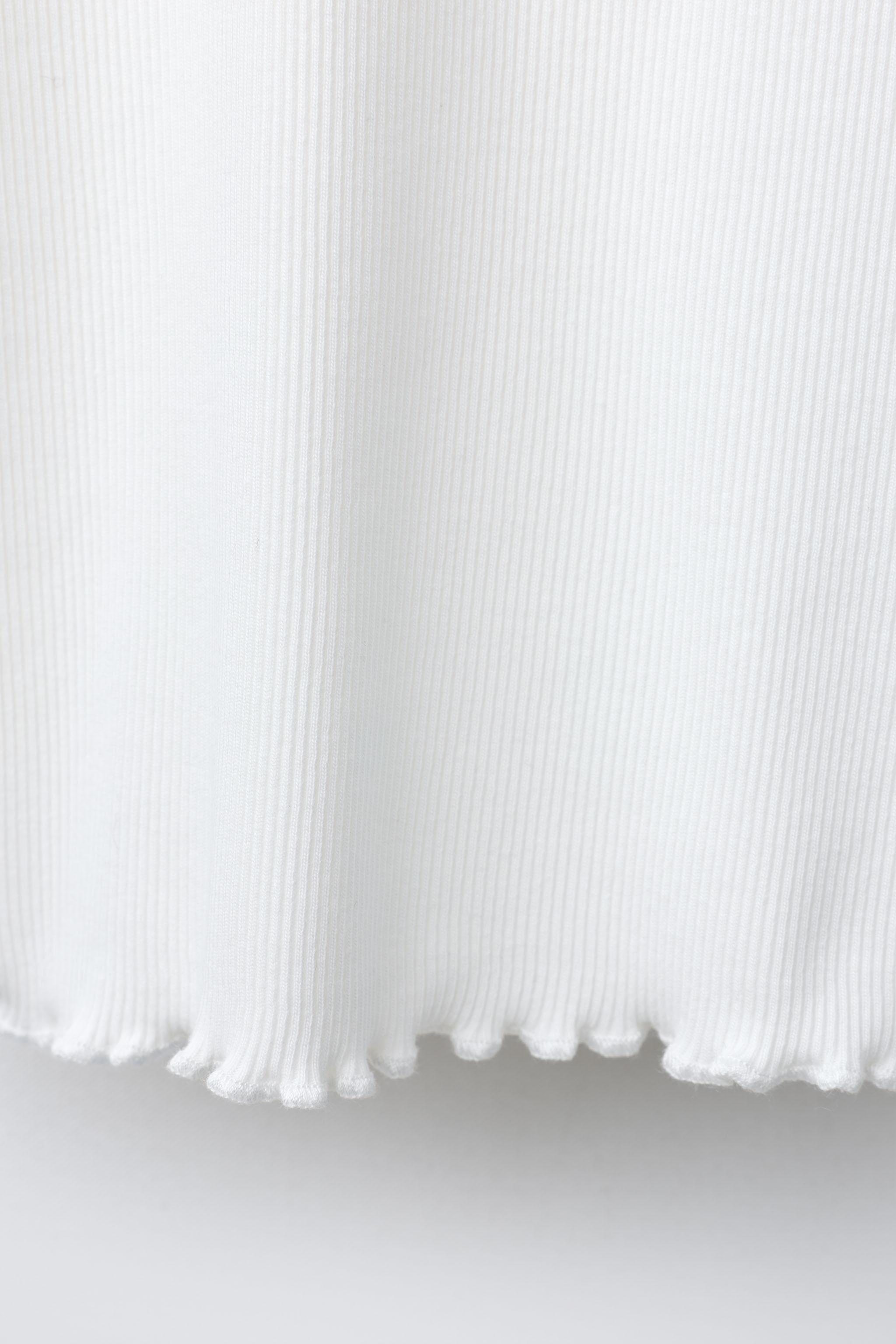 RIB T-SHIRT WITH BEADED FLOWERS